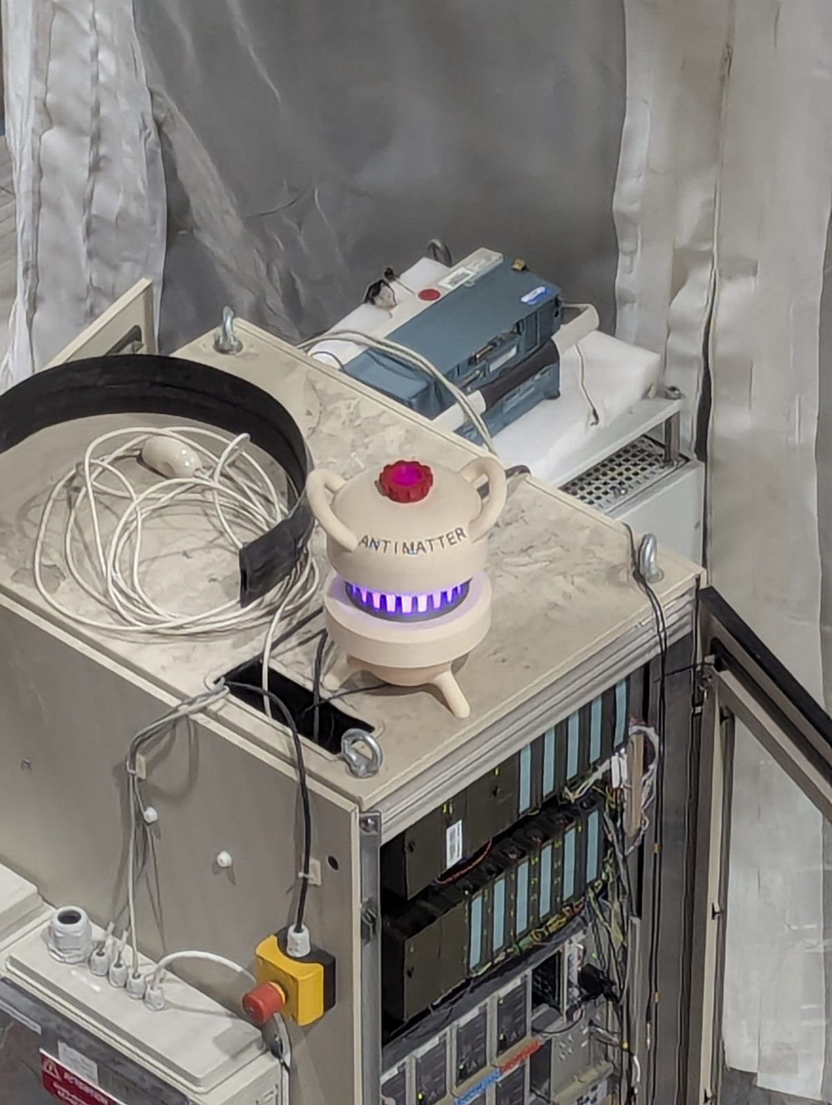 Small ANTIMATTER ceramic prop glowing on a server rack